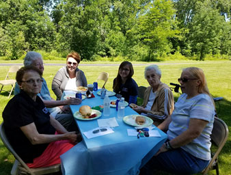 caregivers around picnic table